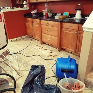 Kitchen undergoing water damage restoration